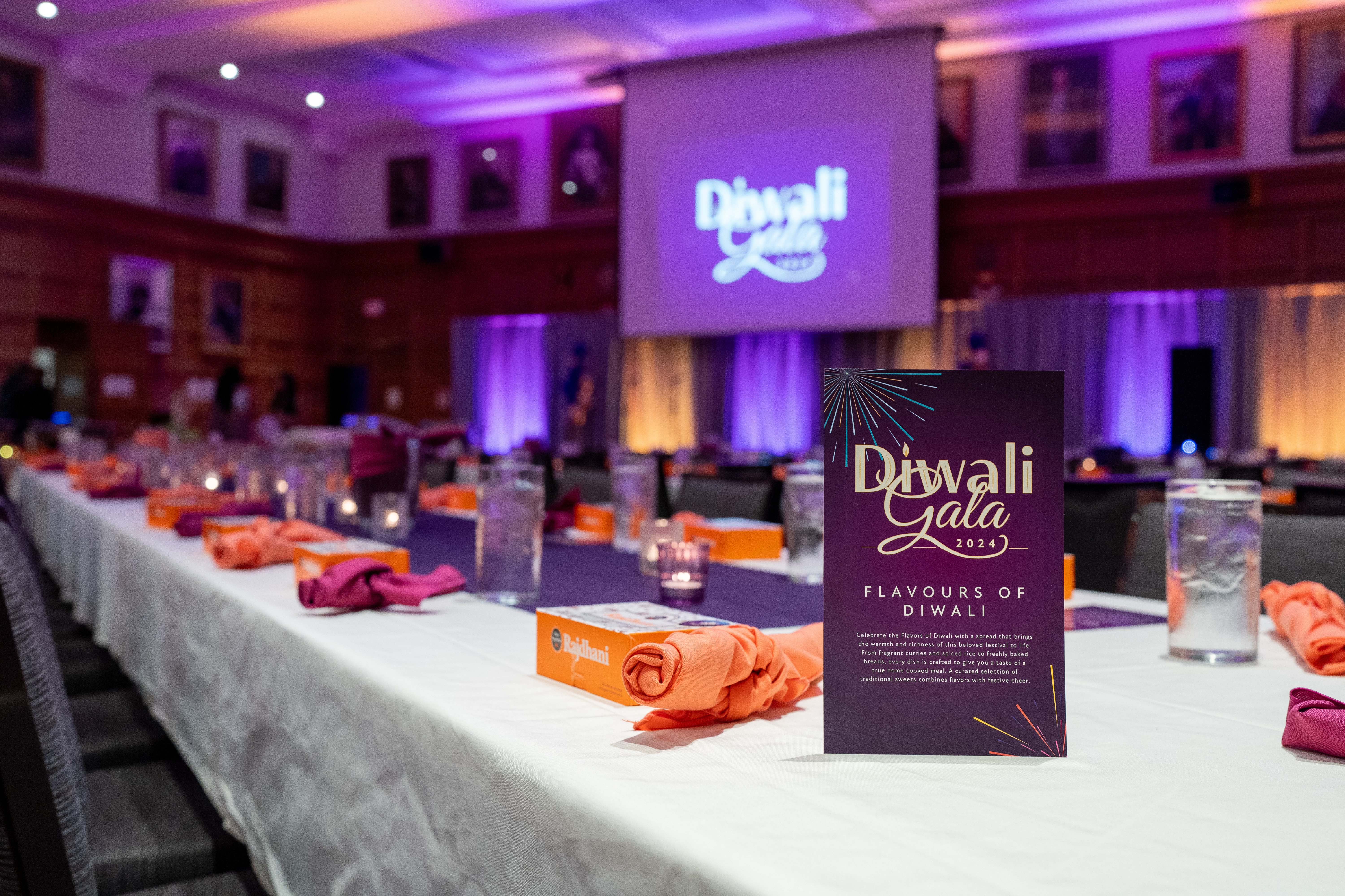 A hall set up with purple and orange décor.  